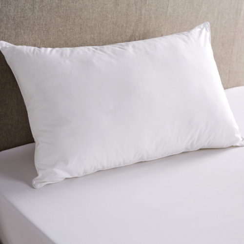 Blenheim Pillow on a bed